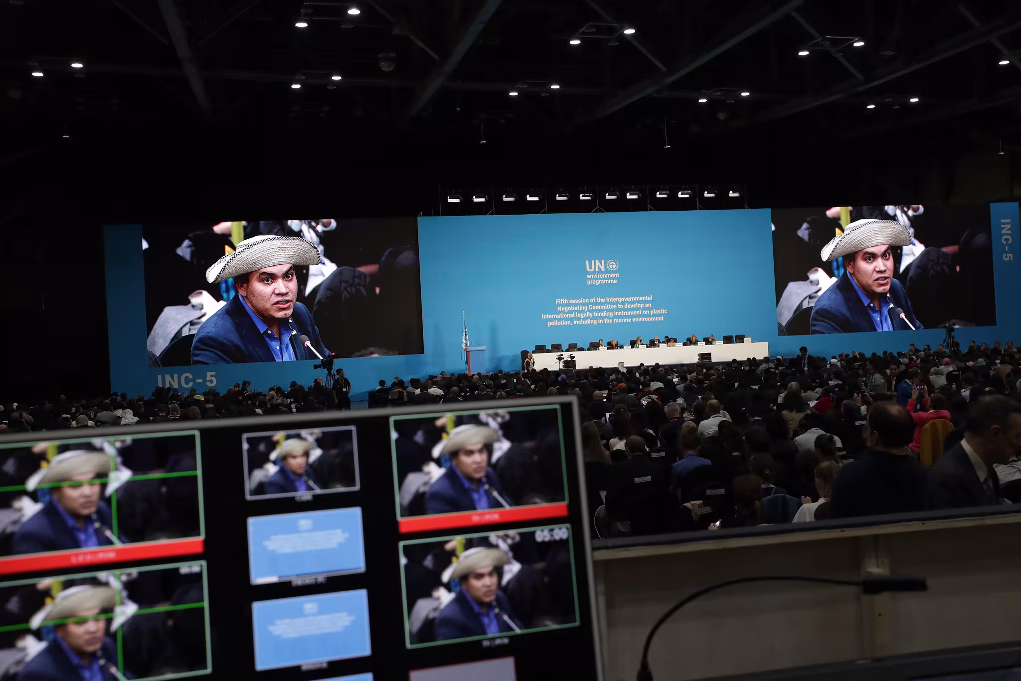 man in straw hat speaking at UN conference